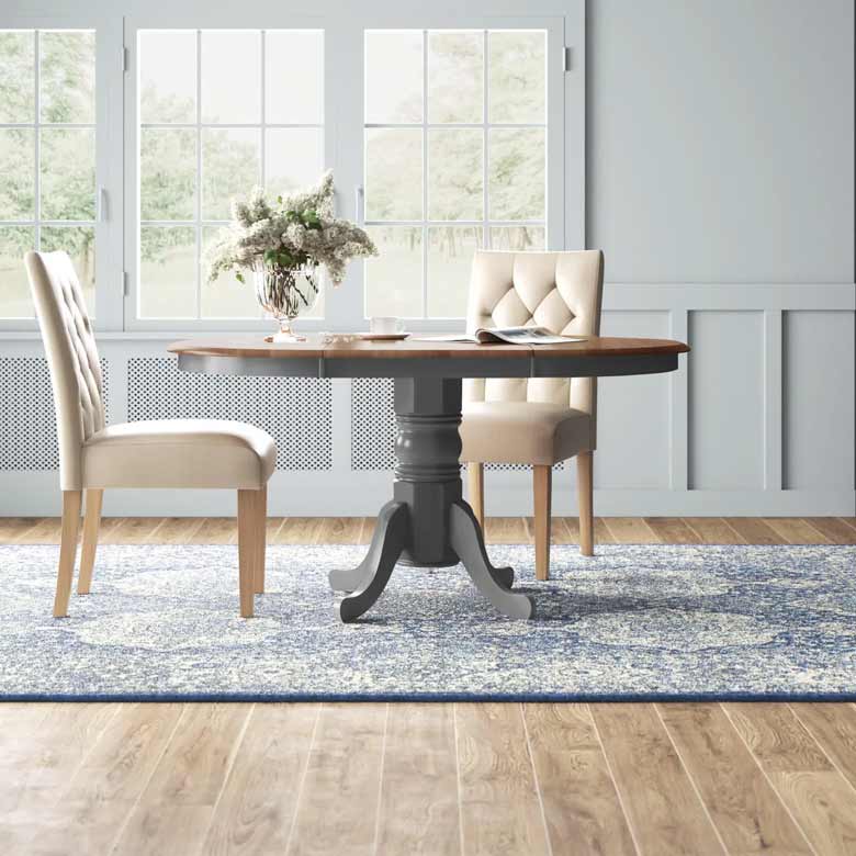 Gray walnut extendable dining table from round to oval with a removable leaf