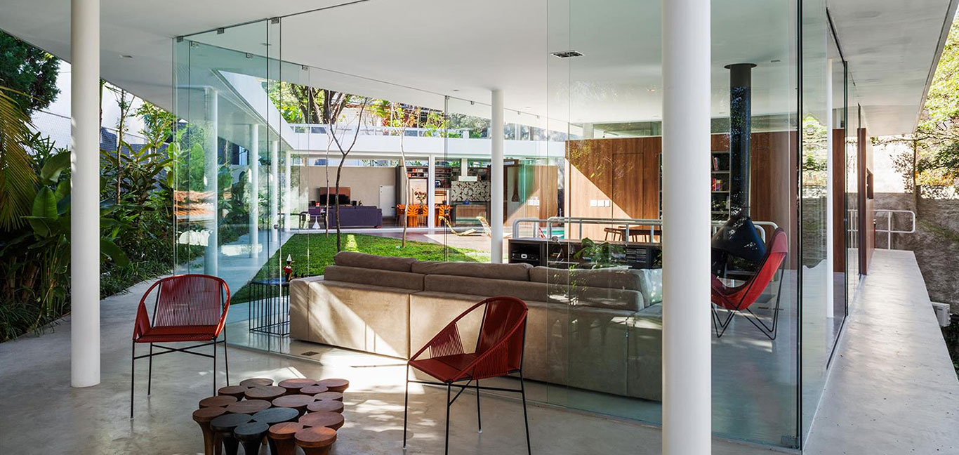 Incredible, spectacular living room full of glazing that allows for seamless transition to the outdoors and offers great views of the garden - Sao Paulo house by FGMF Architects