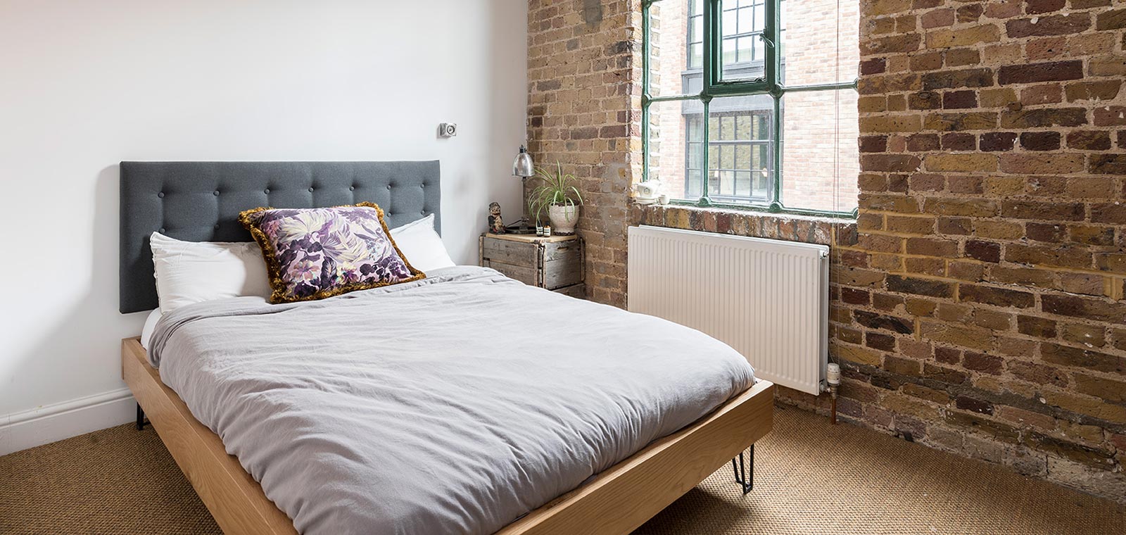 Cozy bedroom design idea in a renovated penthouse located in London