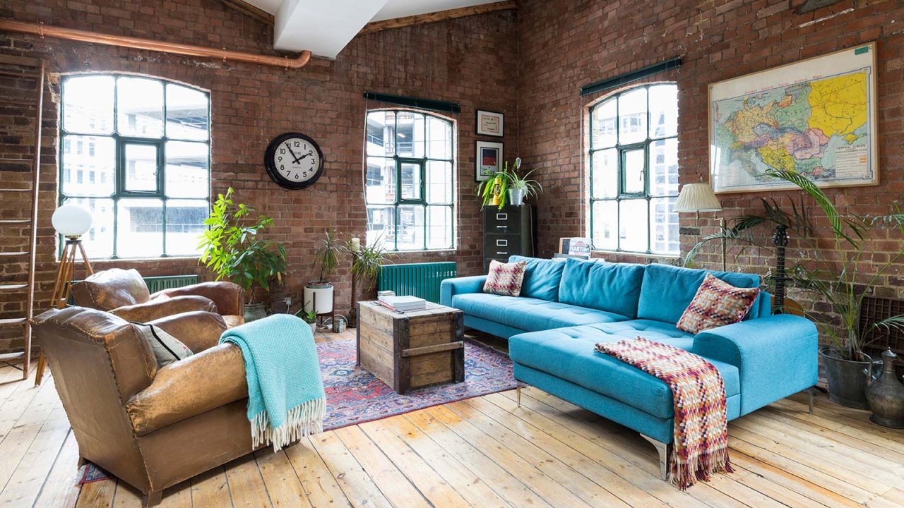 Industrial penthouse located in Shoreditch, London features exposed brick walls and copper elements