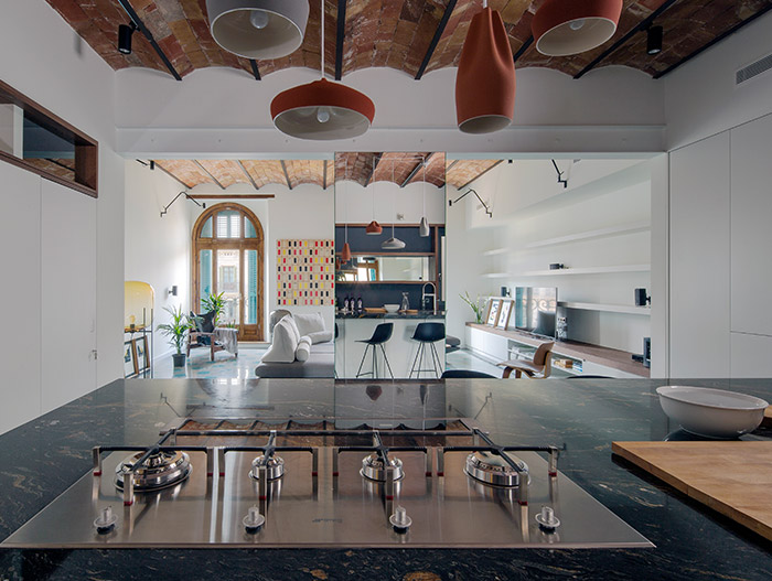 This stunning apartment in Barcelona designed by Nook Architects benefits uses mirrors to amplify space and light