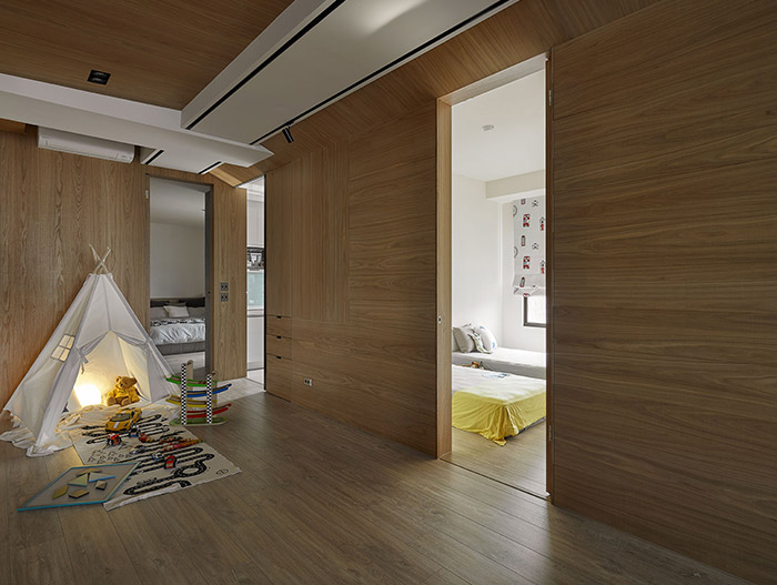 This inviting apartment in Taoyuan, Taiwan by Awork Design Studio was designed to have plenty of spaces for the kids to play