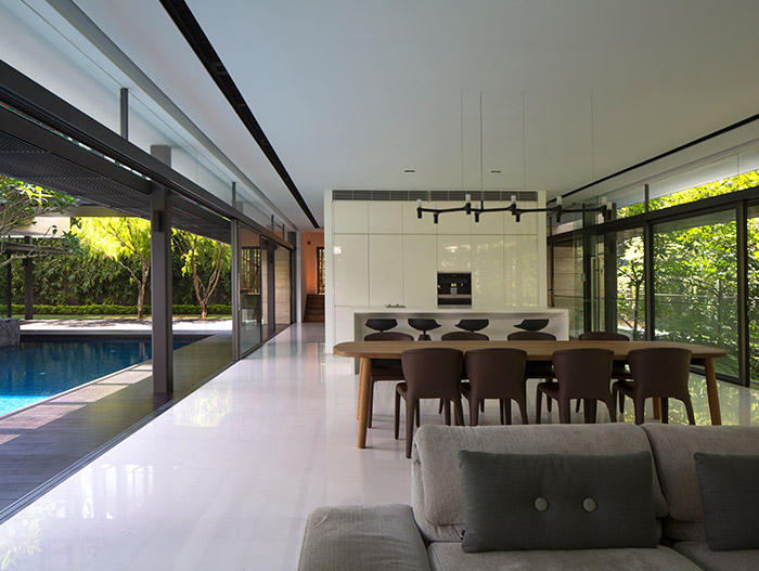 Secret Garden House: Open-space kitchen, dining and living room design idea in a luxurious, contemporary home in Singapore by Wallflower Architecture + Design
