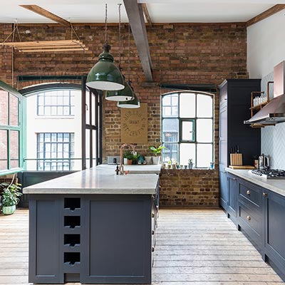 Industrial kitchen design idea in a renovated London penthouse