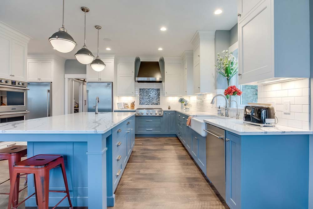 Light blue kitchen ideas | kitchen with light blue cabinets, a farmhouse sink and white backsplash