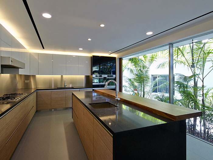 Modern kitchen in Sentosa Cove holiday retreat for a family living by the sea