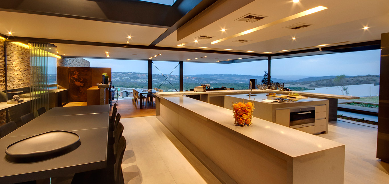 Luxurious open-space kitchen, dining and living area in a contemporary mansion with magnificent views - House Boz by Nico van der Meulen Architects