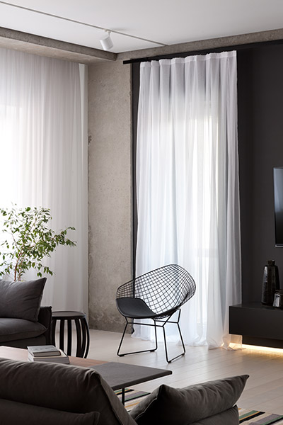 Beautiful living room in elegant Ukrainian apartment by NOTT Design