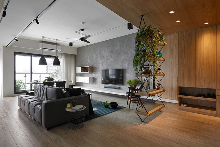 Explorer by Awork Design Studio: Stylish living room design idea in a modern, inviting apartment in Taiwan with plenty of spaces for the kids to play