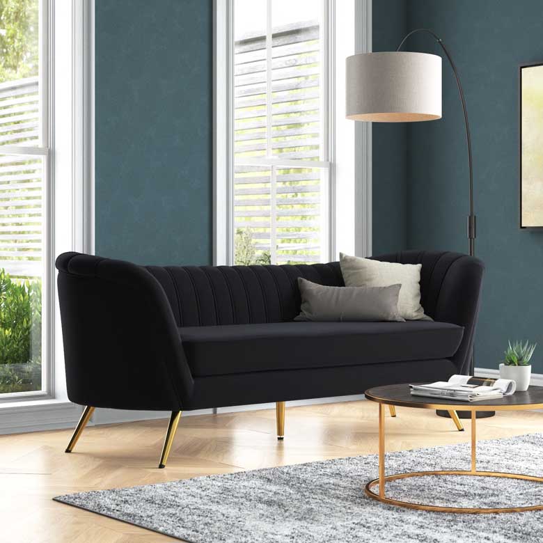 Luxurious black velvet sofa for a modern, eclectic living room