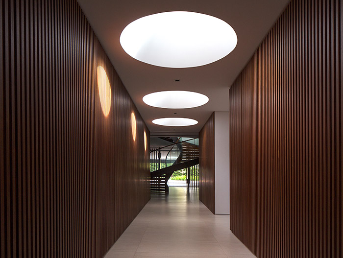 Beautiful spiral staircase design idea in a contemporary home in Singapore by Wallflower Architecture + Design