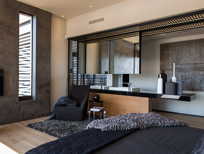 Luxurious and spacious bedroom design idea in a contemporary mansion with magnificent views - located in South Africa