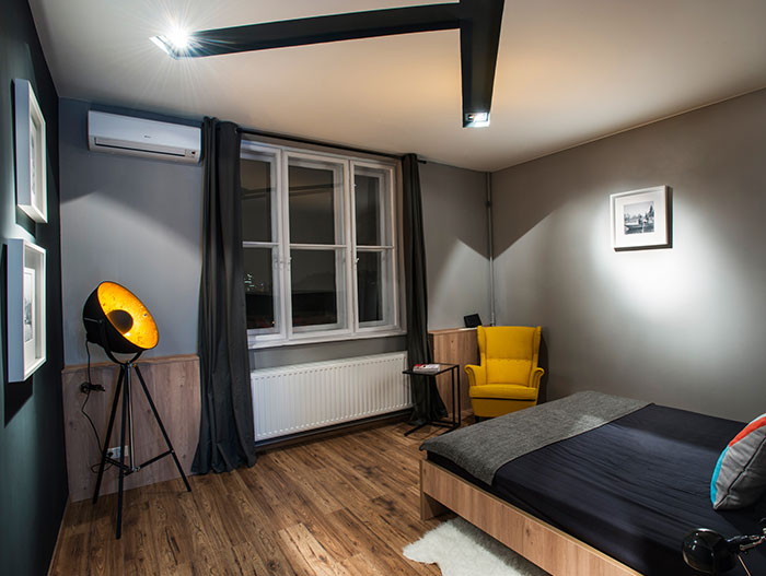 Master bedroom in Hungarian apartment - in downtown Budapest - with unusual and colorful furniture and accent pieces 