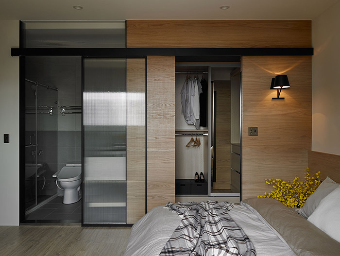 Modern master bedroom design idea with small bathroom and beautiful dressing in an inviting apartment in Taiwan - by Awork Design Studio