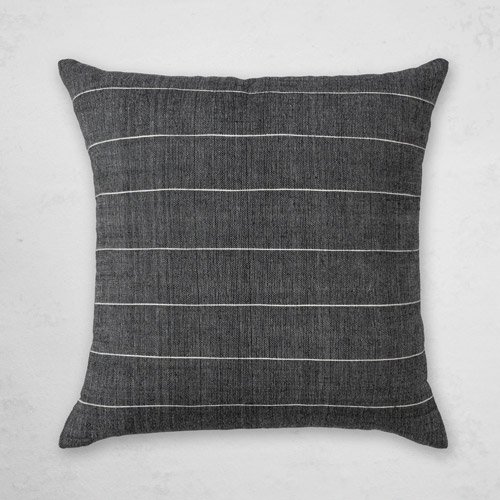 Minimal black throw pillow with white stripes