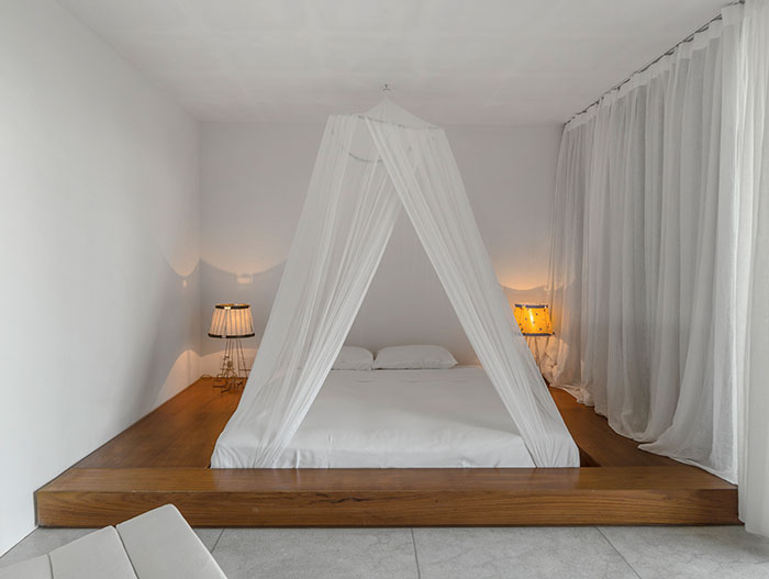 Minimalist white bedroom design with amazing bed in Brazil