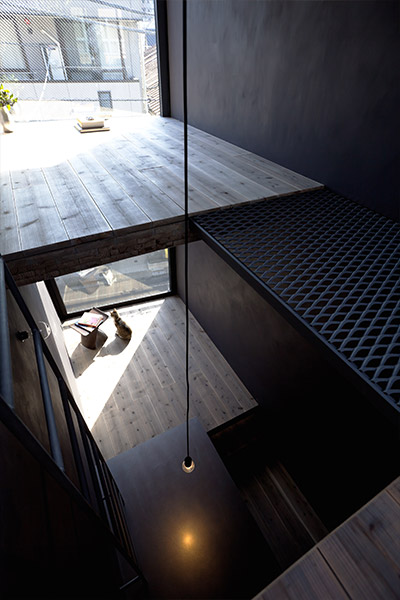 Minimalist interior in a super narrow house in Tokyo, Japan divided into several floor levels - designed by YUUA Architects