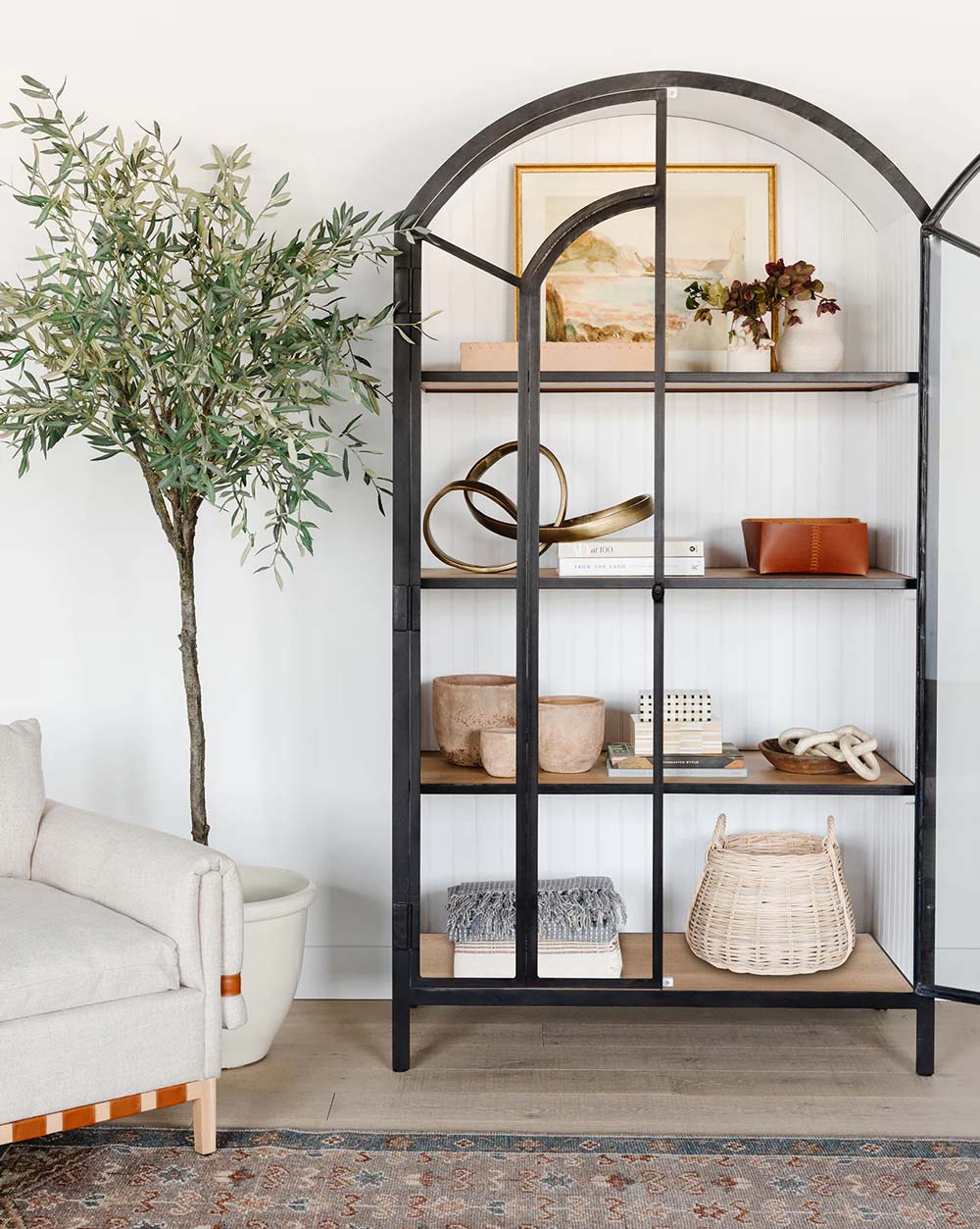 Modern arched cabinet that features oak wood shelves | Modern glass arched cabinet with plenty of storage space