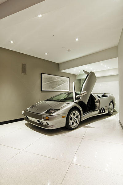 Modern Hollywood bachelor pad with Lamborghini near living room