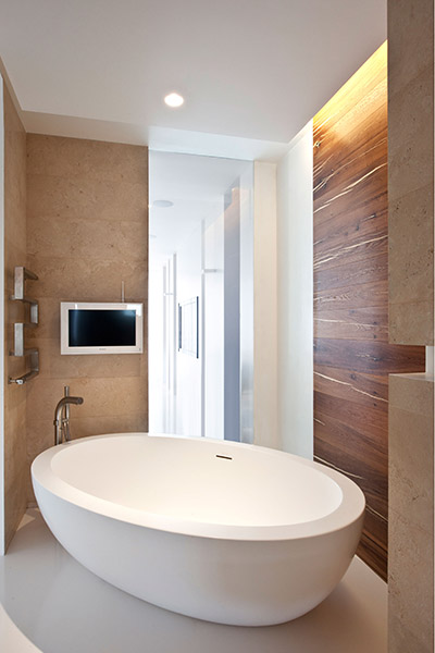 Modern bathroom with TV in all white apartment Moscow