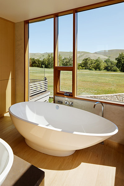 Modern bathroom & tub in great Californian retreat that balances privacy with openess