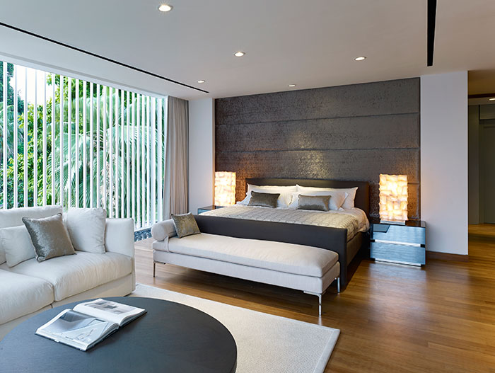 Modern bedroom in stunning Sentosa Cove holiday retreat for a multi-generational Chinese family
