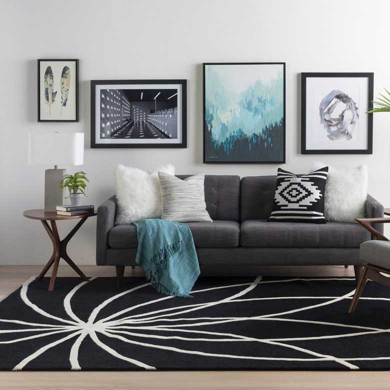 Modern black rug with bold, abstract white pattern