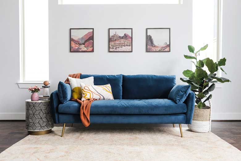 Modern blue velvet sofa for sale - a great option for a stylish living room