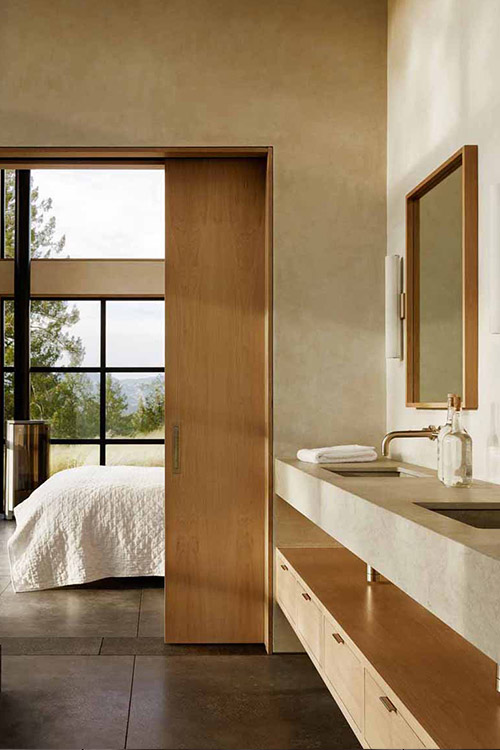 Modern ensuite bathroom leading to master - inside California wine country mansion for a luxurious indoor-outdoor lifestyle 