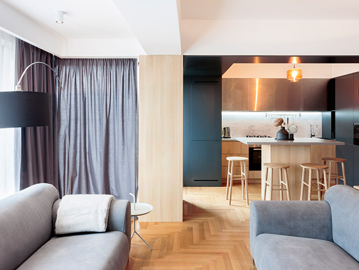 Apartment M by Rosu-Ciocodeica: Small functional apartment with stylish furniture in Bucharest, Romania