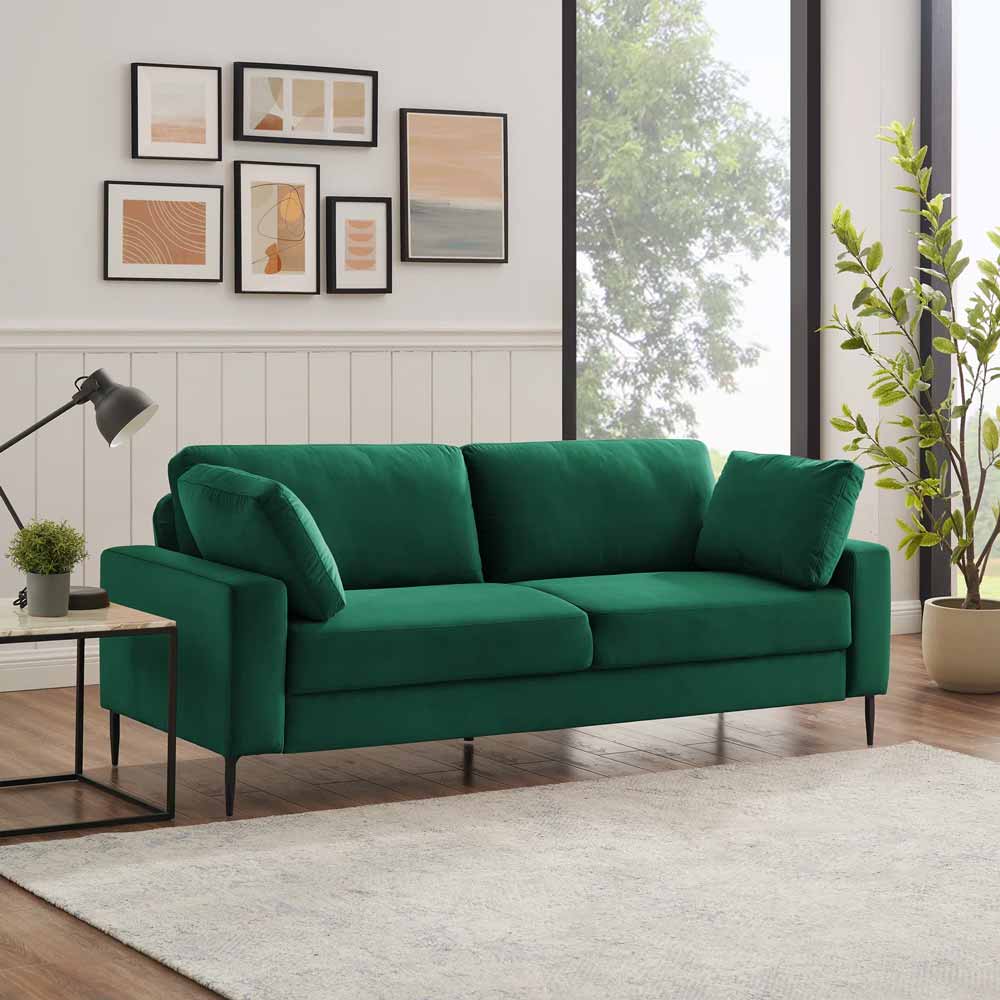 Modern emerald green sofa with slender metal feet for sale, perfect for mid-century-inspired living rooms