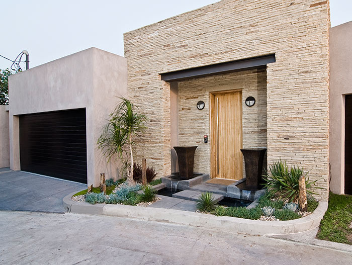 Modern Hollywood bachelor pad with indoor car park entrance