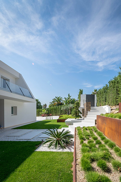 Backyard and garden of modern residence near Barcelona, Spain designed by 08023 Architects which renovated an old residence