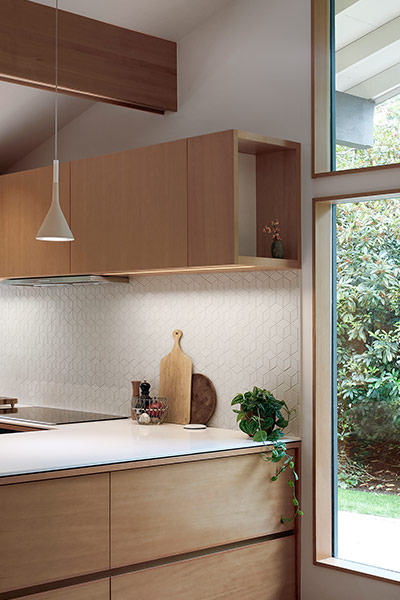 Modern kitchen cabinets for Seattle remodeled residence by SHED Architecture