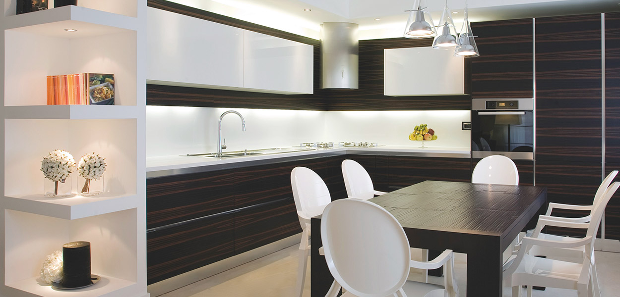 Modern kitchen and dining area in remodeled duplex apartment in Benevento, Italy by interior designer Ernesto Fusco