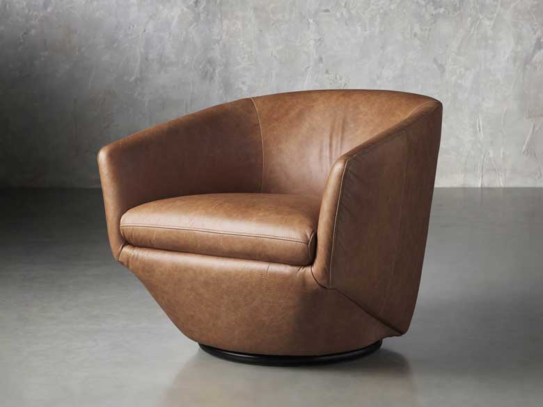 Unique and modern leather swivel barrel chair - this luxurious accent chair is perfect for any contemporary living room 