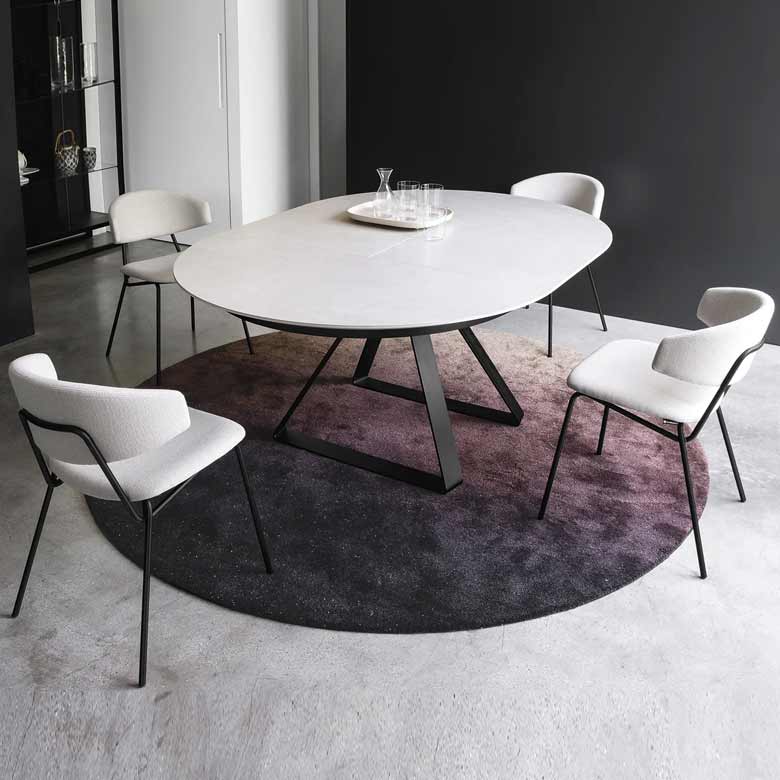 Modern extendable dining table - expands from round to oval shape