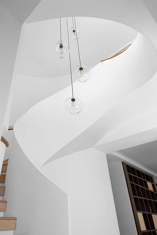 Modern white staircase inside a two-storey Australian addition - design by Luigi Rosselli Architects