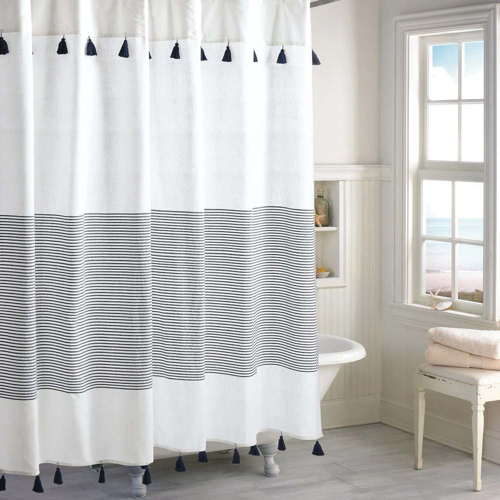 Modern shower curtain for small or large bathrooms with navy stripes and playful tassels