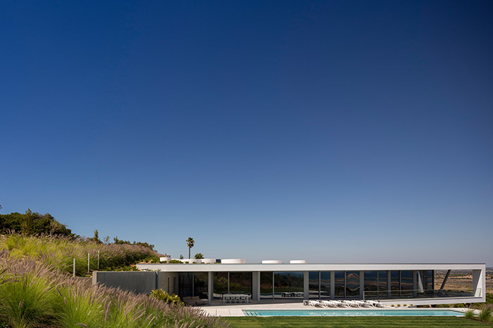 Modern Zauia House by Mario Martins Atelier offers stunning views of Lagos Bay; great example of Portuguese architecture