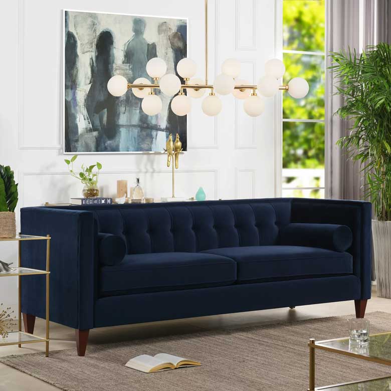 Navy velvet tuxedo sofa for sale with with retro lines, button tufting and tapered wooden legs