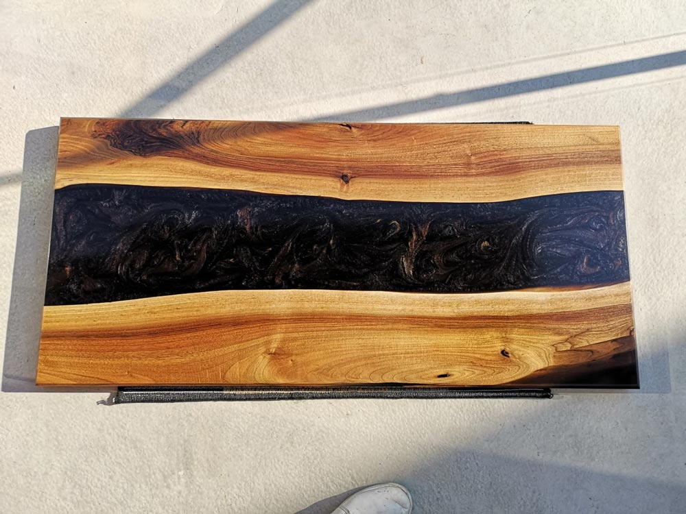 Nebula resin river coffee table - black epoxy resin poured in multiple stages