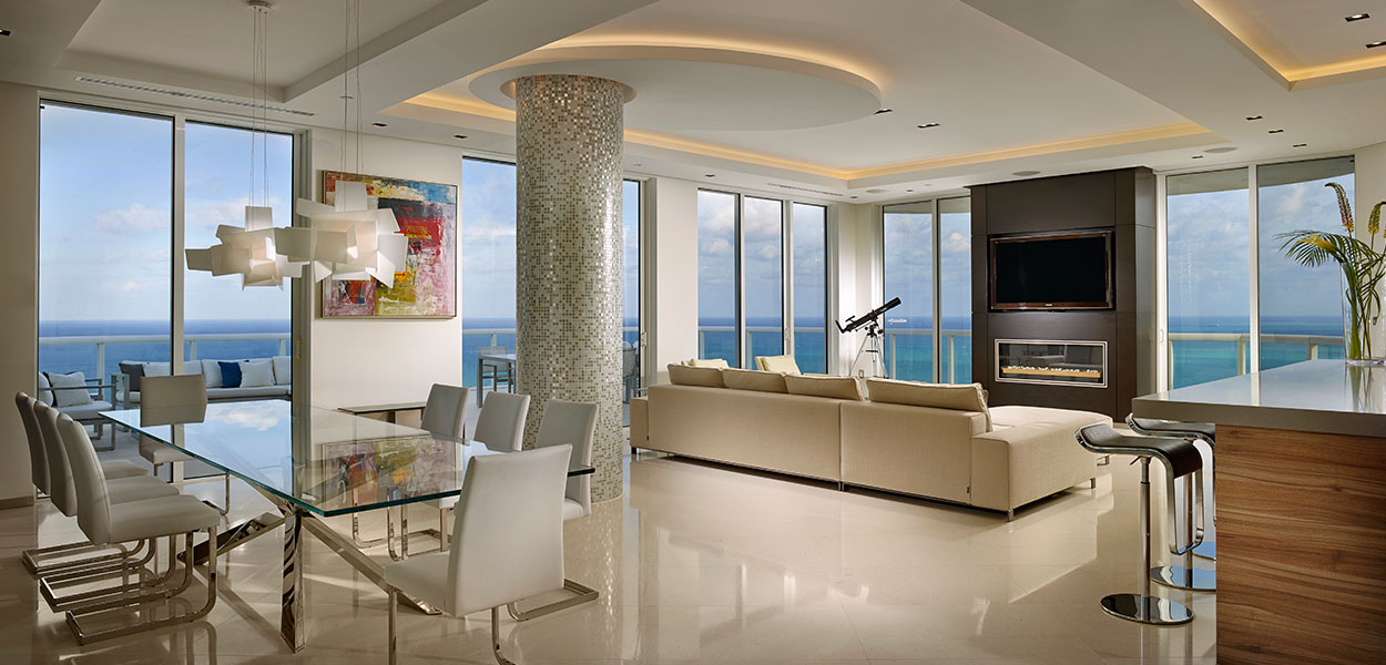 Open-plan kitchen and living area in a breathtaking penthouse by Pepe Calderin Design with unbelievable Miami Beach views