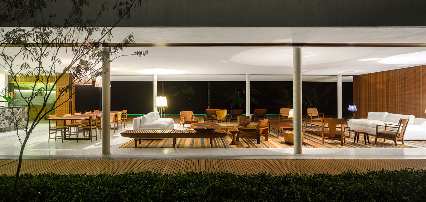 Open-plan living and dining area in striking modern house with amazing views of the Atlantic Ocean by Studio MK27