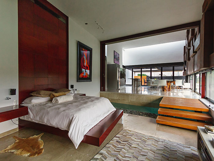 Open space bedroom and living room in lakeside house in Mexico