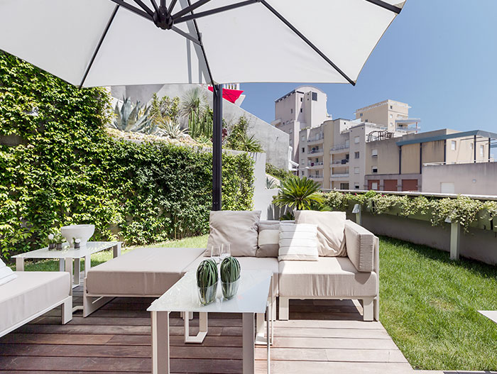 Amazing outdoor lounge area in modern, spacious apartment near Monaco for a relaxing and lavish stay on the French Riviera