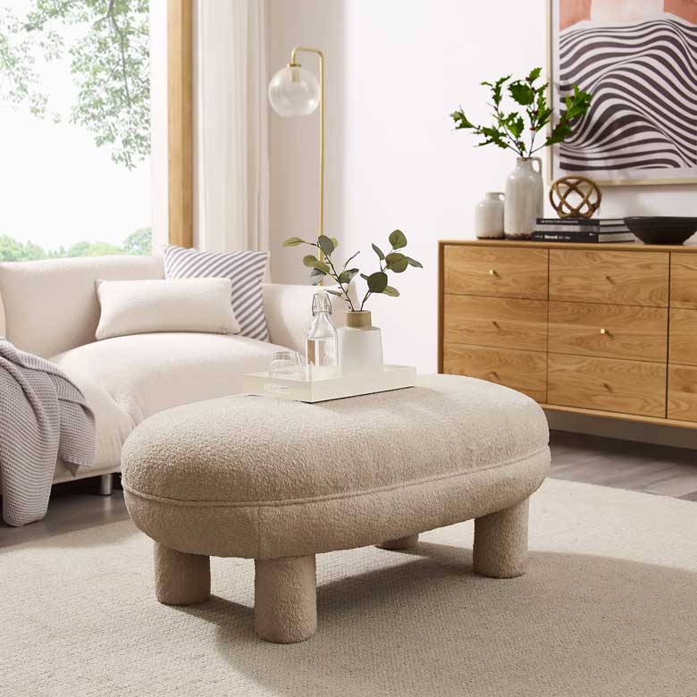 Cozy oval boucle ottoman with legs - can be used as coffee table
