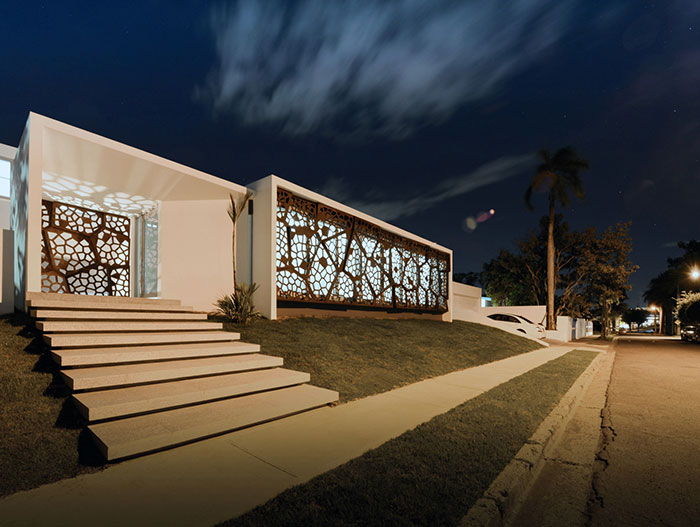 Puerto Rican villa entrance night view - award-winning renovation project by Diaz Paunetto Architects