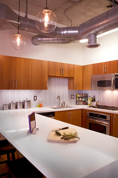 Modern kitchen design in South Park loft shelving system - Unit was remodeled on a limited budget by CHA:COL