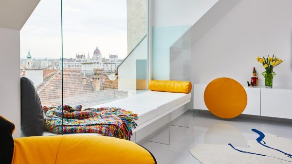 Renovated apartment in Budapest, Hungary by Margeza boasts custom furniture and impressive views
